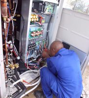 Technician during installation of the cooling systems
